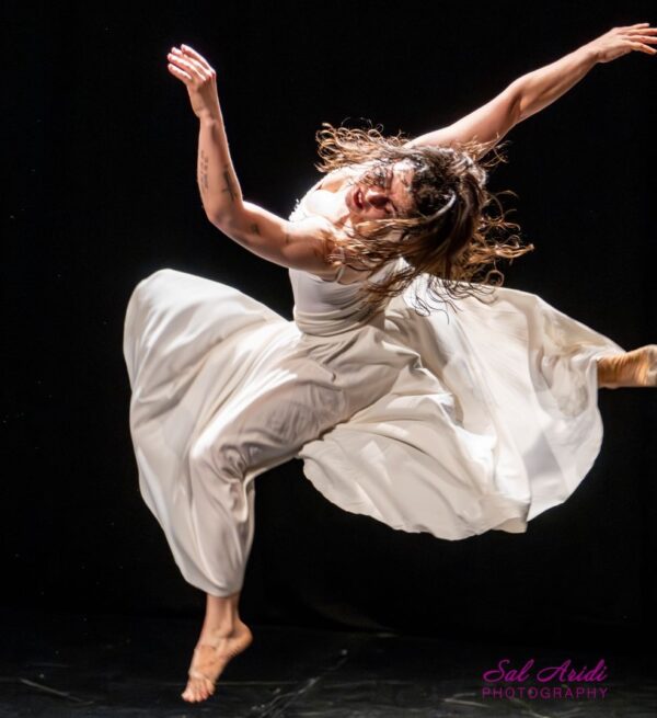 A dancer in a white dress