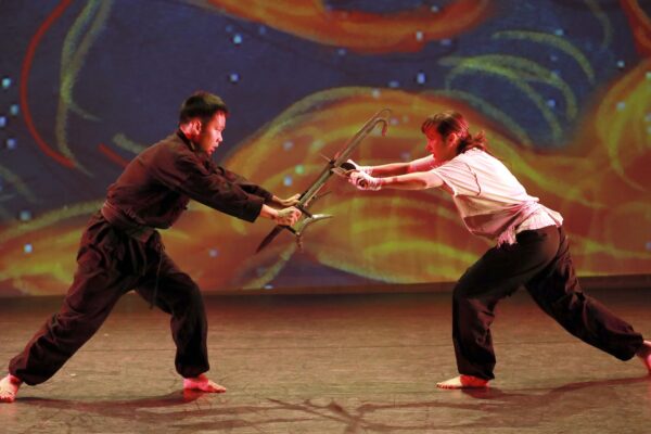 Two dancers with swords