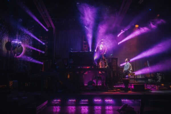Dancers in purple lighting