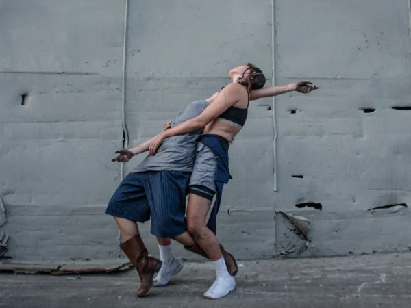 Two dancer bending backwards