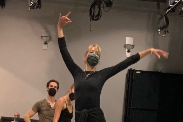 A dancer in a face mask