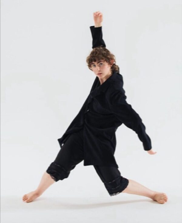 A dancer in black poses