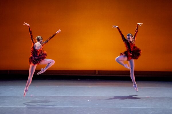 Two dancers in red