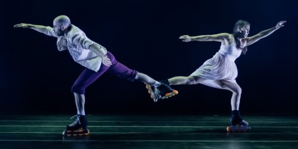 Two skaters hook skates