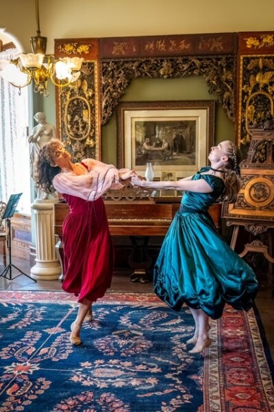 Two women in old fashioned setting