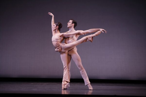 Two dancers in arabesque