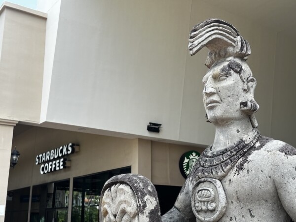 Maya-style warriors in front of Paradise Village's Starbucks