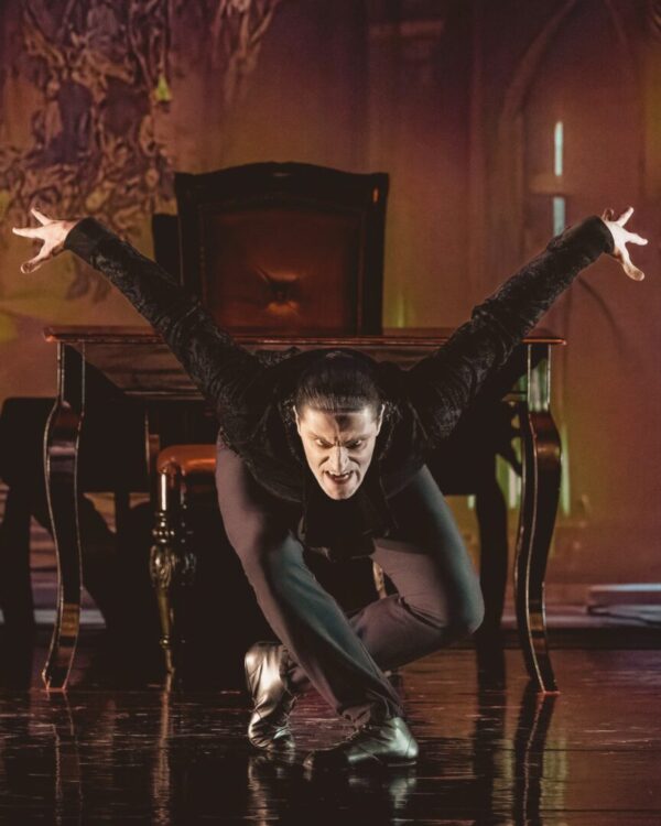 A vampire figure crouches